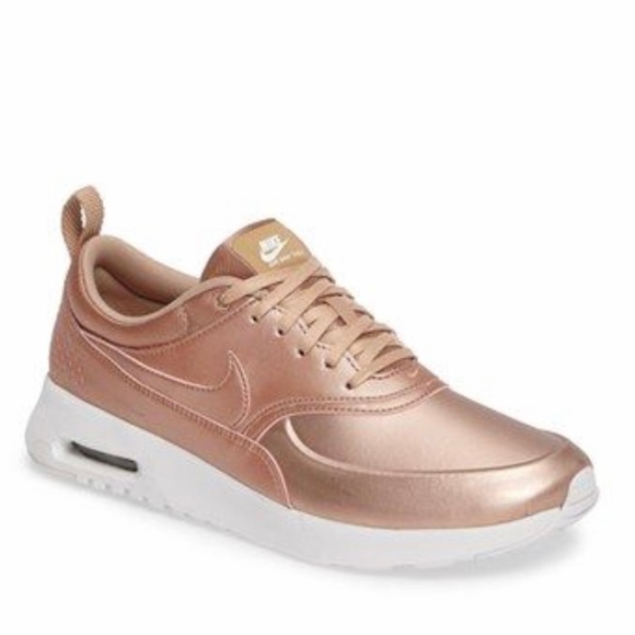 thea nike gold